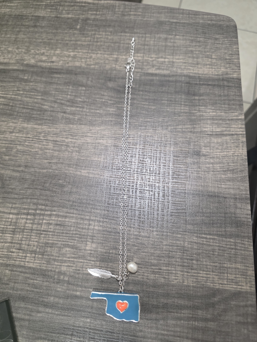 Silver Necklace with Blue Oklahoma Pendant and Heart Accent